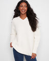 Ecru boucle sweater with relaxed fit and V-neck, perfect for cozy days. Long sleeves add warmth by Charlie B.