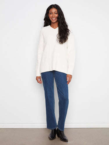 Elegant ecru sweater showcasing a relaxed fit and cozy long sleeves, perfect for any casual outfit by Charlie B.