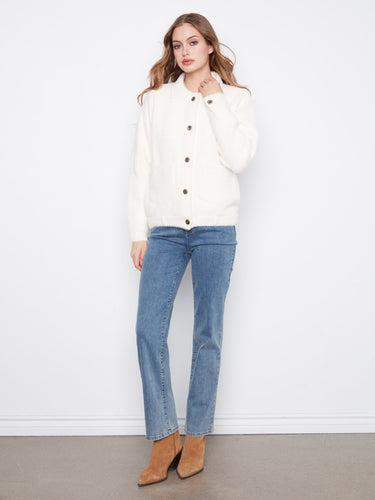 This soft fuzzy knit jacket offers warmth and comfort, ideal for chilly days. By Charlie B.