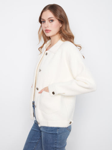 Featuring convenient patch pockets, this stylish jacket adds practicality to any outfit. By Charlie B.