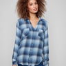 Blue plaid blouse featuring a classic shirt collar, adding a timeless touch to the design by Charlie B.