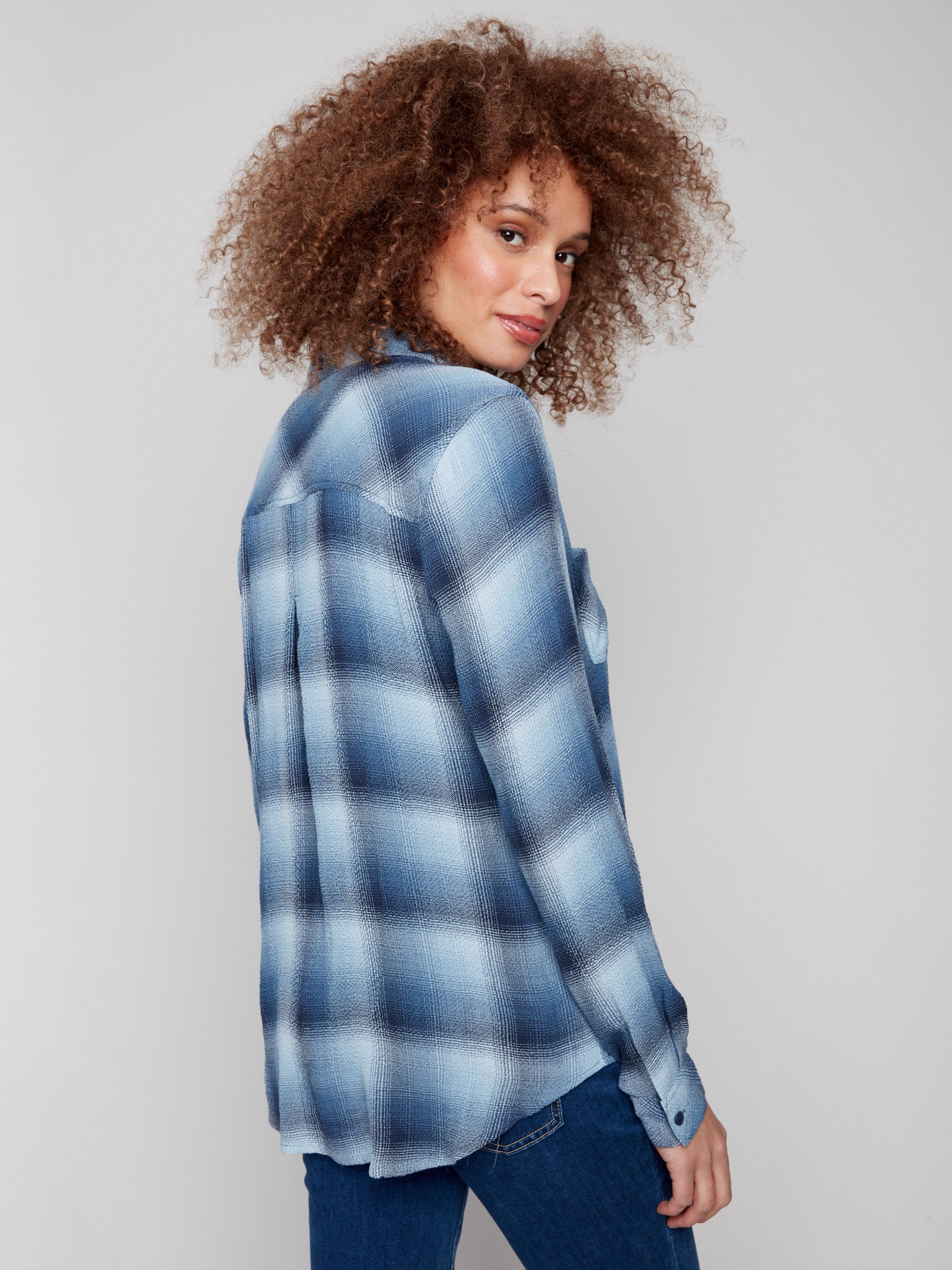 Button-down plaid blouse with two chest pockets, offering both style and functionality by Charlie B.