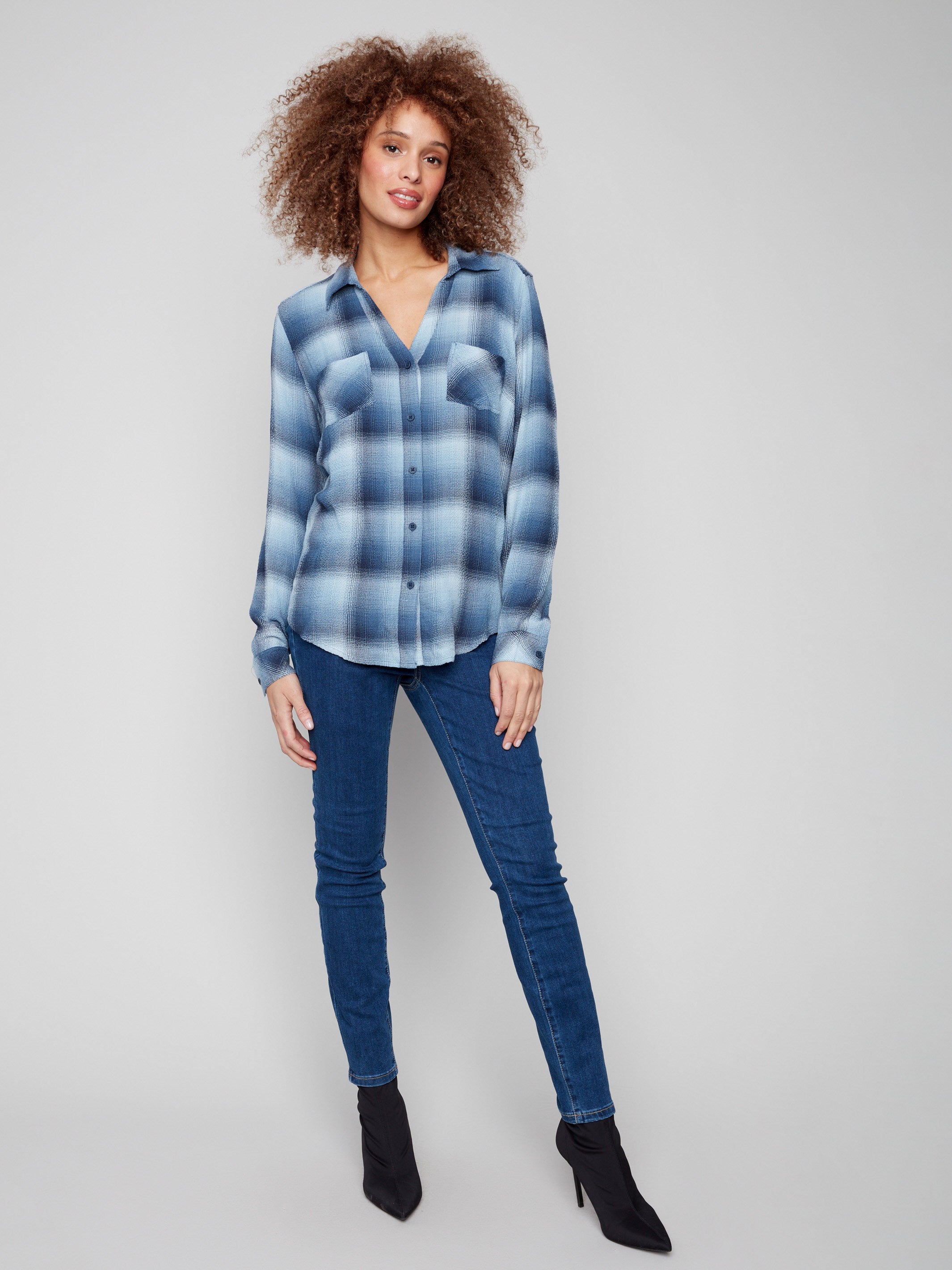 Elegant blue plaid blouse with button-down closure for a refined yet casual look by Charlie B.