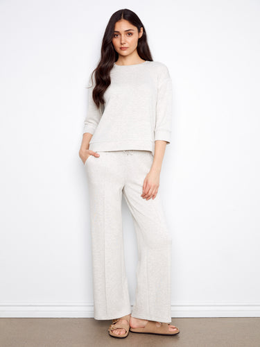 Experience ultimate ease in this garment's 3/4 sleeves, crafted for everyday wearability and charm by Charlie B.
