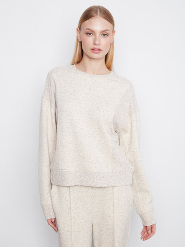 Featuring a cozy crew neck, this top offers a comfortable fit in soft scuba fabric by Charlie B.