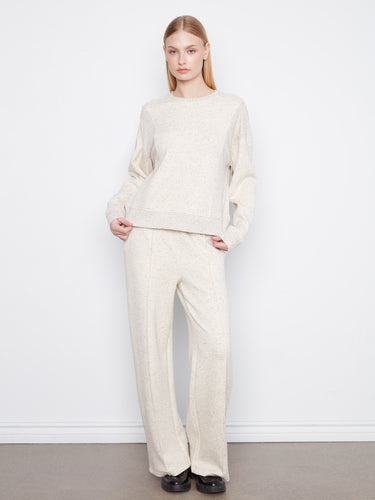 The relaxed fit makes it ideal for layering over other outfits effortlessly. By Charlie B.