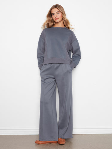 Featuring long sleeves, this stylish top offers both warmth and elegance in a versatile soft scuba fabric by Charlie B.