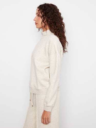 Long sleeves add warmth to this chic half-zip mock neck made from soft scuba fabric, combining style and comfort effortlessly. By Charlie B.