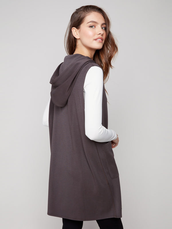 Chic sleeveless mocha vest showcasing its flattering mid-thigh length and practical pockets by Charlie B.