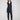 Black sleeveless vest with mid-thigh length, featuring a zip front and patch pockets by Charlie B.