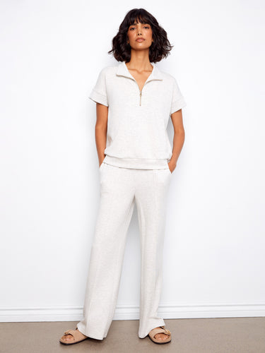 This elegant top features a mock neckline, enhancing its sophisticated look. The heather light grey color is versatile by Charlie B.
