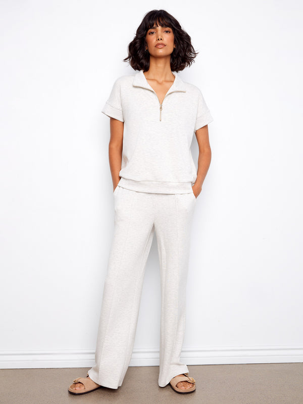 This elegant top features a mock neckline, enhancing its sophisticated look. The heather light grey color is versatile by Charlie B.