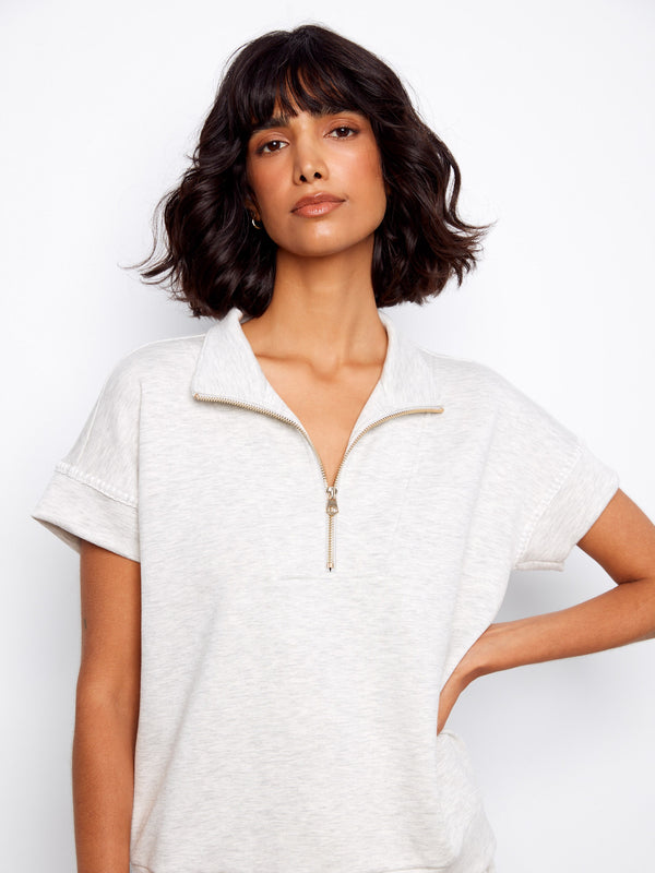 Heather light grey top with blanket stitch detail adds subtle texture. Short sleeves offer a relaxed fit by Charlie B.