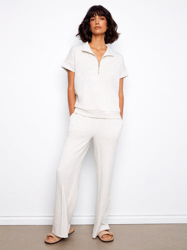 A modern take on the classic short sleeve design in heather light grey, featuring sleek half-zip detailing by Charlie B.