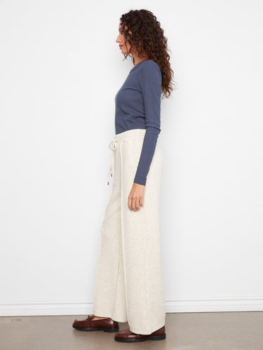 Stylish slash pockets on these wide leg pants provide both function and flair by Charlie B.