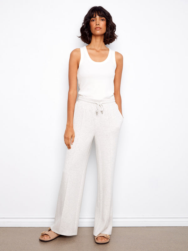 These pants feature a wide leg design, offering a relaxed and comfortable fit. Perfect for casual outings. By Charlie B.