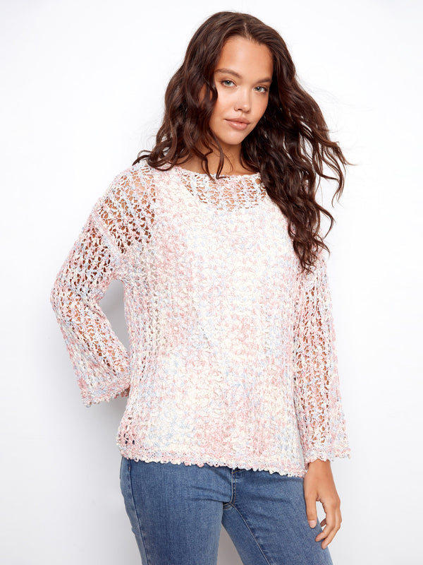 This stylish top features a classic crew neckline, perfect for any casual outing. The intricate design adds elegance by Charlie B.