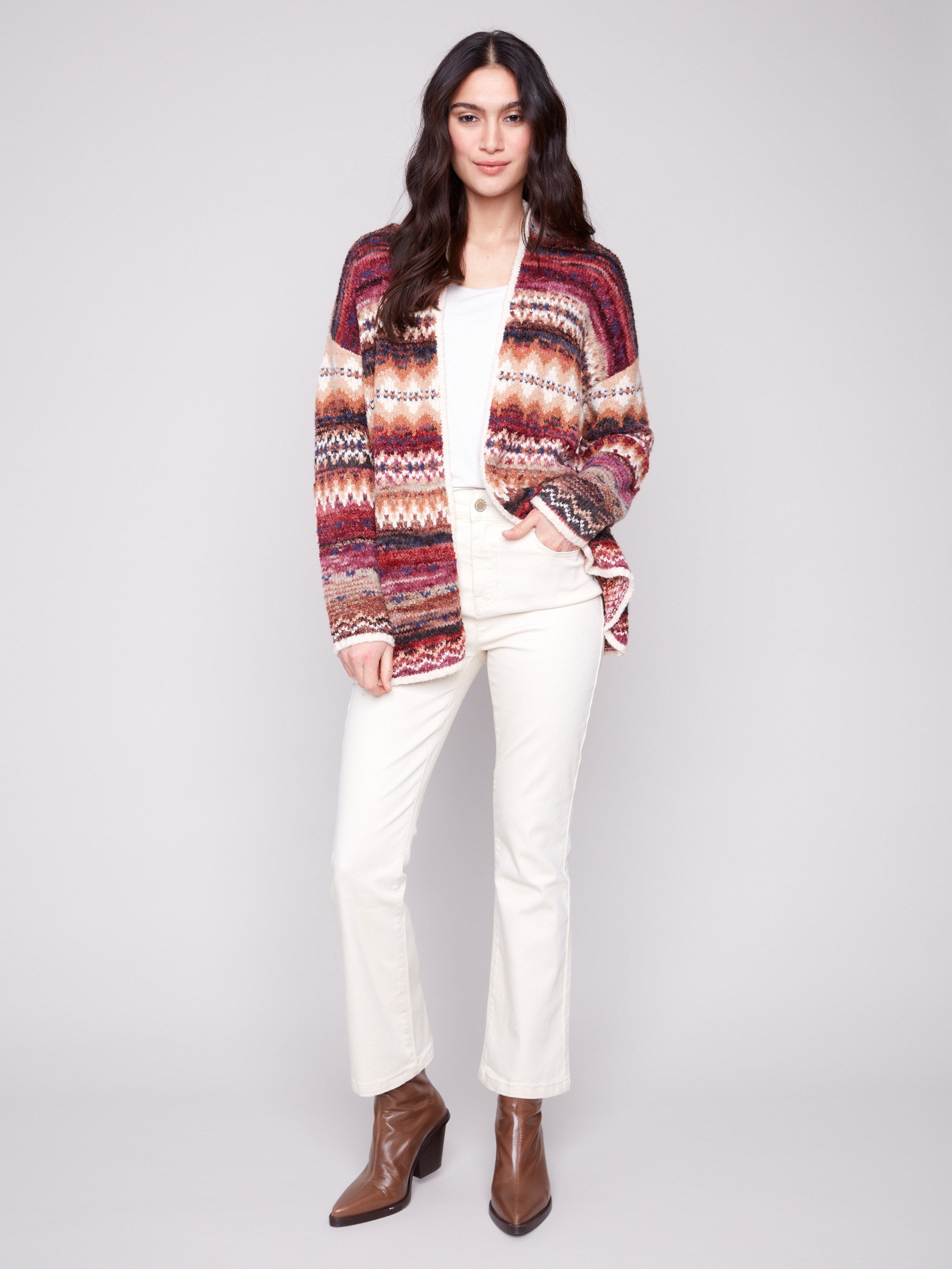 Adorned with side seam pockets, this Space Dye Jacquard Cardigan adds functionality to style by Charlie B.