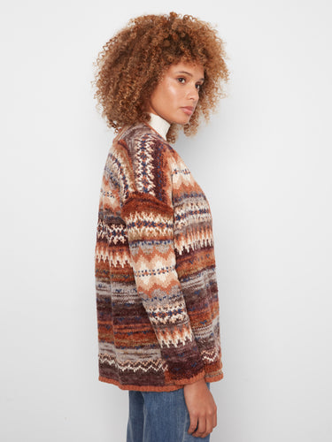 Stylish side seam pockets enhance functionality in this cozy, patterned cardigan by Charlie B.