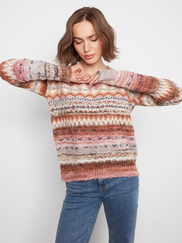 V-neckline sweater with a relaxed fit and intricate patterns for an effortless style. By Charlie B.