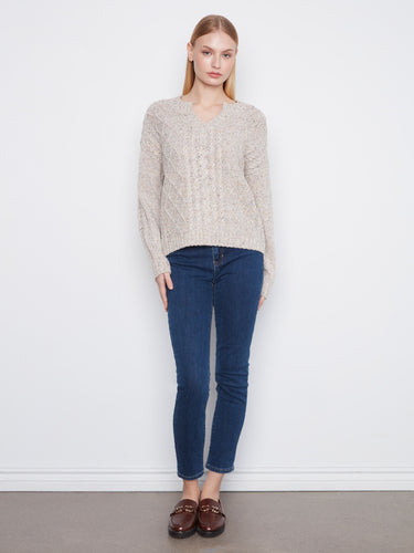 Crafted from speckled yarn, this sweater offers a unique texture and style by Charlie B.