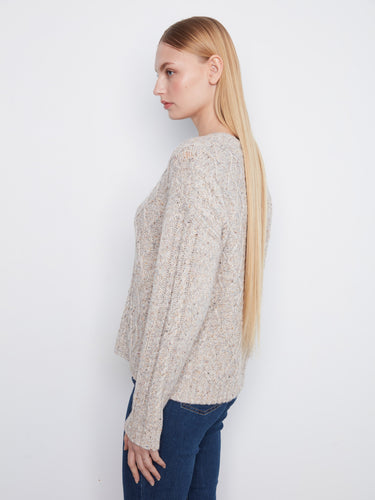 This cozy knit showcases intricate patterns for a sophisticated look by Charlie B.