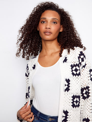 Stylish white cardigan with unique geometric patterns, ideal for casual outings by Charlie B.