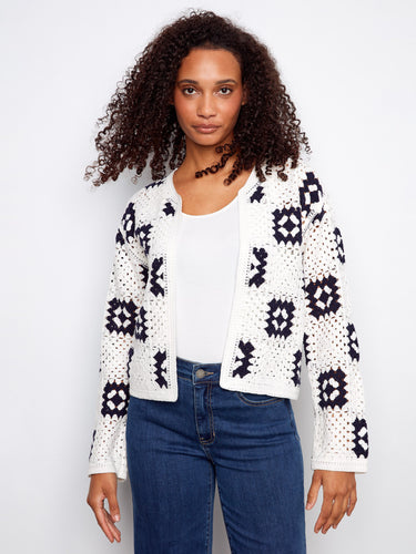 Fashion-forward white cardigan showcasing beautiful geometric details and fine craftsmanship by Charlie B.