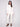 Elegant white sweater showcasing raglan sleeves and shimmering stars, perfect for a stylish look by Charlie B.