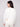 Chic white sweater with plush knit fabric and shimmering star details, providing warmth and style by Charlie B.