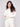 Stylish white sweater with long raglan sleeves and subtle metallic stars for an understated elegance by Charlie B.