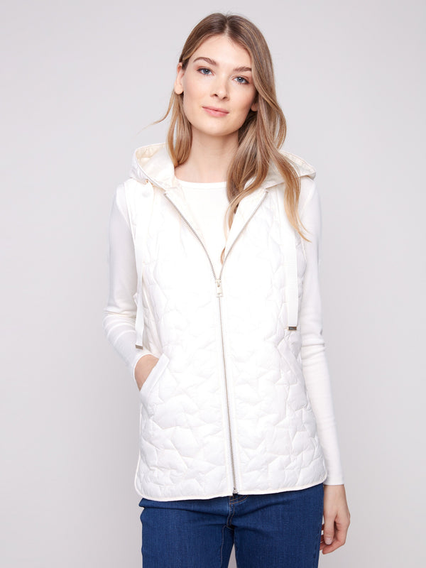 Stylish short vest in ecru features an attached hood and drawstrings, accented by star quilting details by Charlie B.