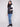 Sleek black vest with a zipper front closure, adorned with quilted stars and practical welt pockets by Charlie B.