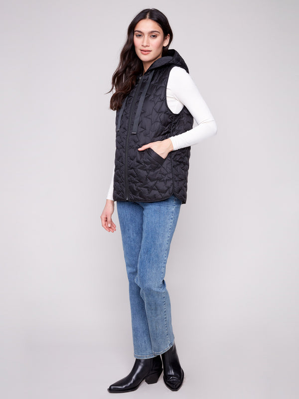 Sleek black vest with a zipper front closure, adorned with quilted stars and practical welt pockets by Charlie B.