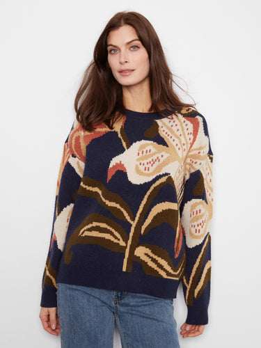 Chic navy blue sweater adorned with an abstract floral motif in warm tones, offering a relaxed fit by Charlie B.