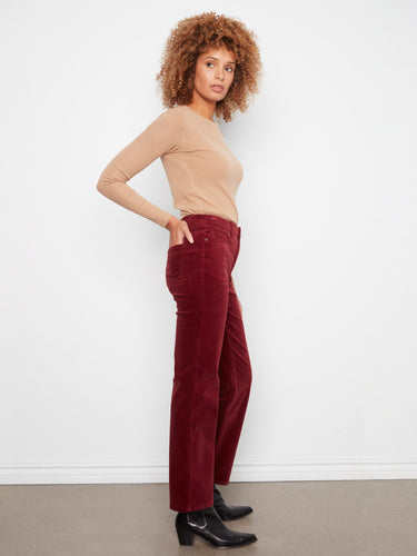 The hidden elastic waistband adds convenience and a sleek appearance to these fashionable pants by Charlie B.