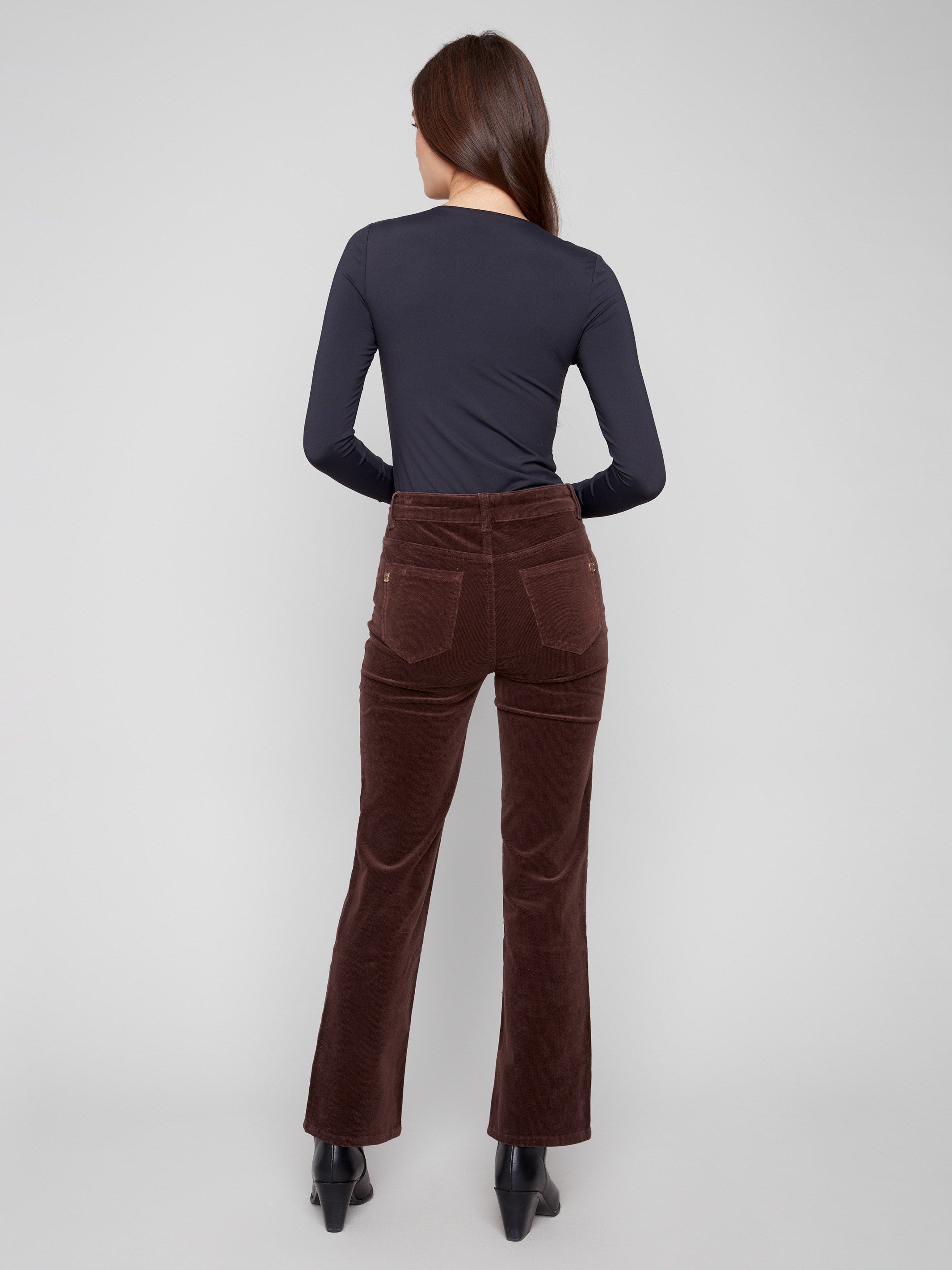 Mocha corduroy pants with a regular rise, designed for everyday wear and easy pairing by Charlie B.