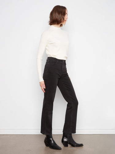 Designed with a zip fly and button closure, these jeans offer both style and practicality by Charlie B.