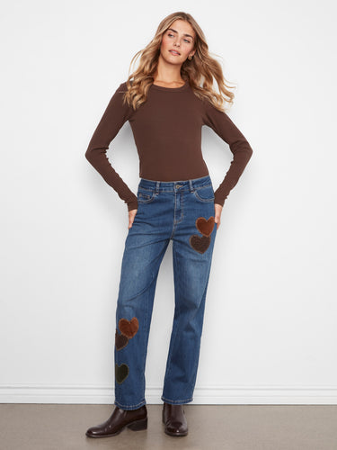 Crafted from premium denim, these jeans showcase distinctive corduroy and leopard-print hearts for added flair. By Charlie B.