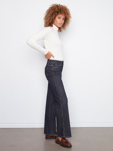 Crafted from stretch denim, these jeans provide comfort and flexibility for everyday wear. By Charlie B.
