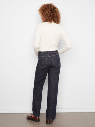 The scalloped outseam with raw hem adds a unique touch to these full-length jeans. By Charlie B.