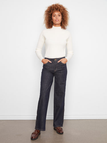 Designed with five pockets, these regular rise jeans offer both style and functionality. By Charlie B.