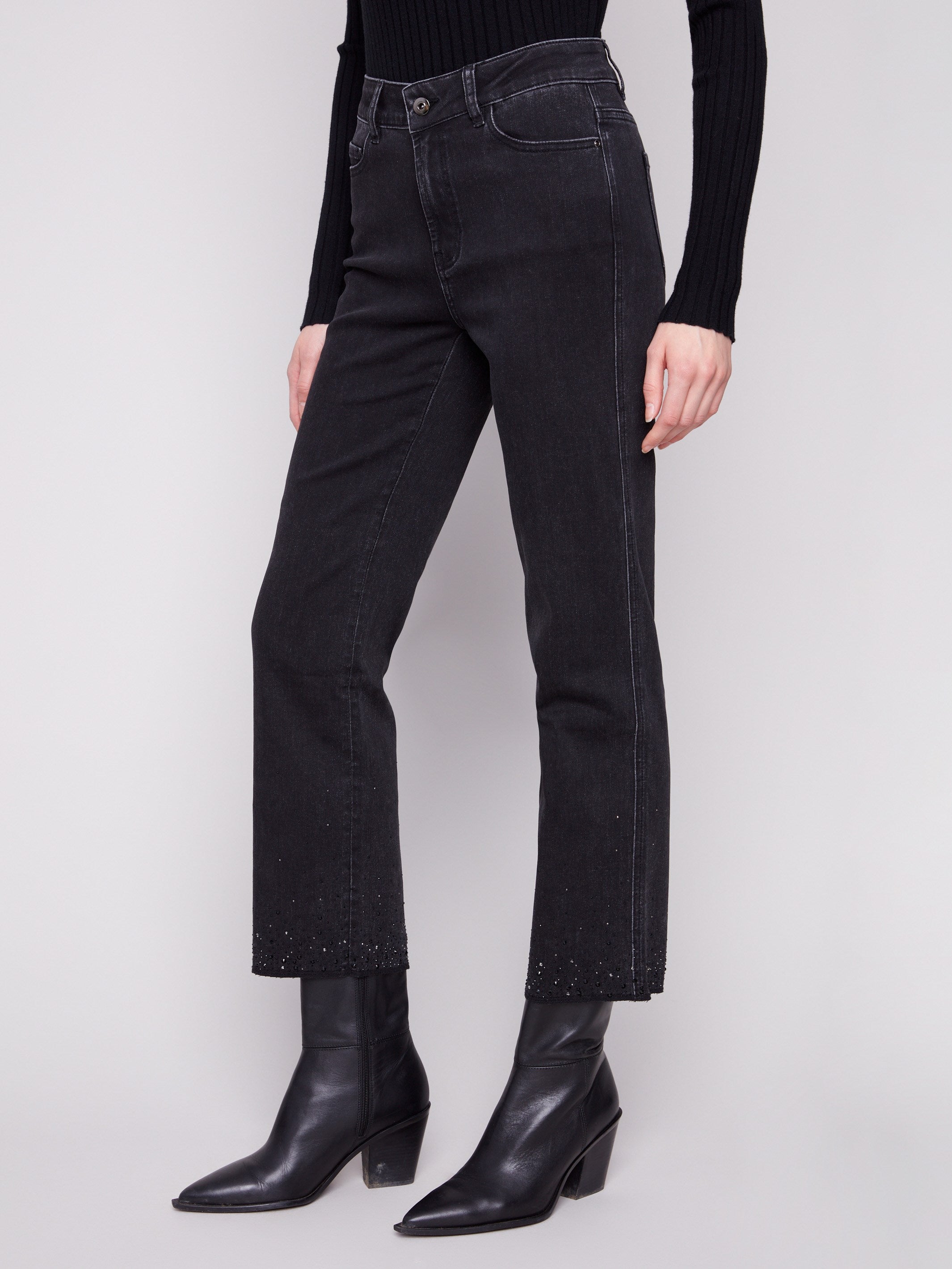 Long-length black jeans adorned with shimmering rhinestones at the hem, crafted for elegance by Charlie B.