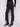 Long-length black jeans adorned with shimmering rhinestones at the hem, crafted for elegance by Charlie B.