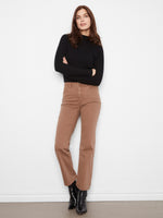 These pants feature a straight leg design, offering a sleek and modern silhouette. Perfect for any occasion. By Charlie B.