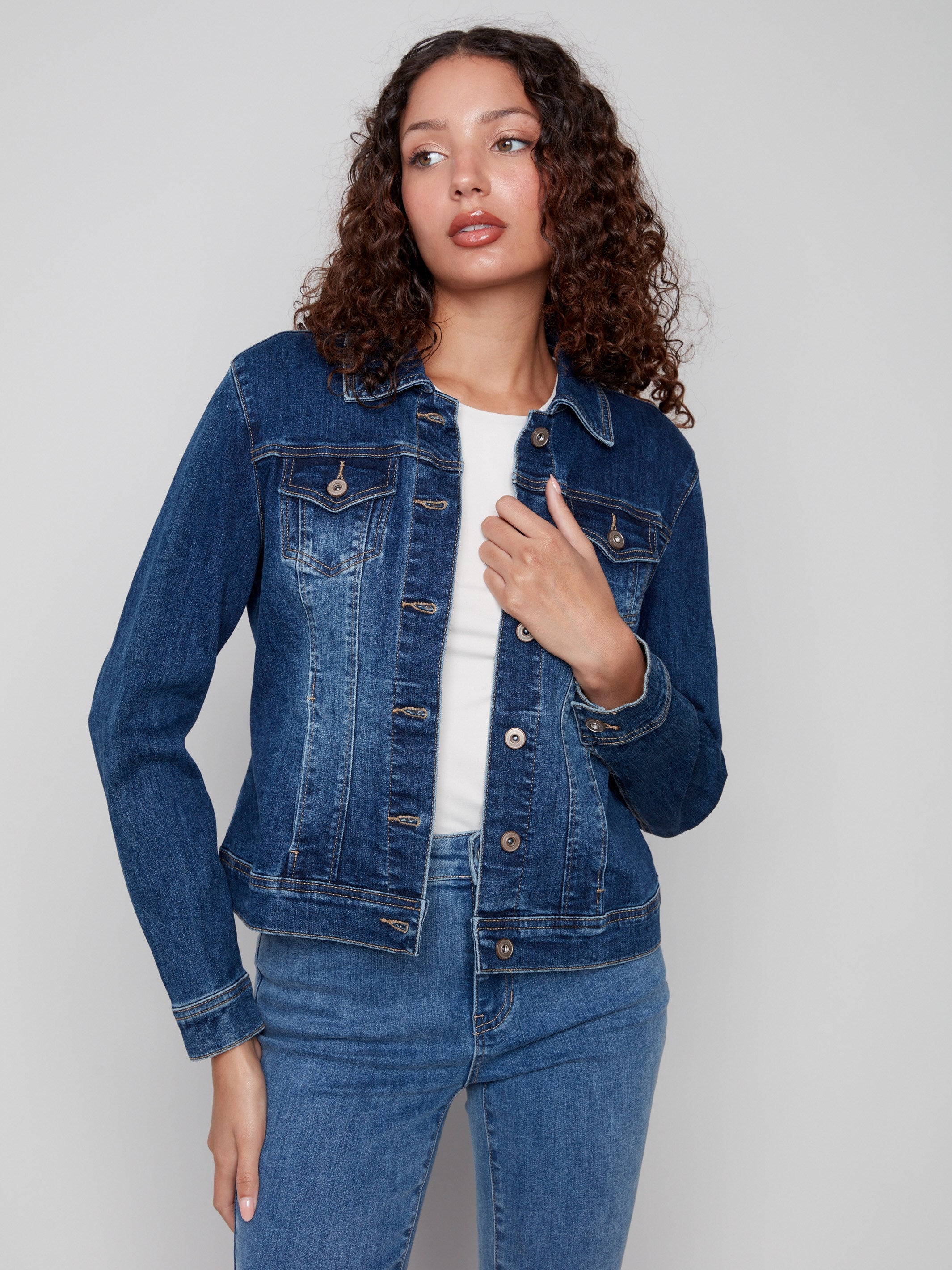 Classic indigo denim jacket with button-flap front patch pockets for added style by Charlie B.