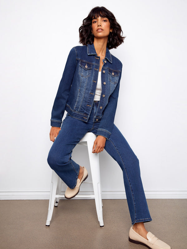 The button front design of this denim jacket adds a touch of elegance to your everyday wardrobe essentials. By Charlie B.