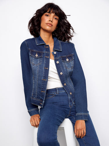 This stylish denim jacket showcases a traditional shirt collar, enhancing its classic appeal and versatility. By Charlie B.
