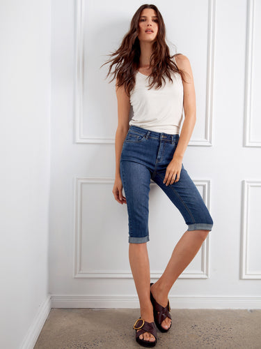 Indigo stretch denim pedal pushers highlighting their versatile slim fit look by Charlie B.