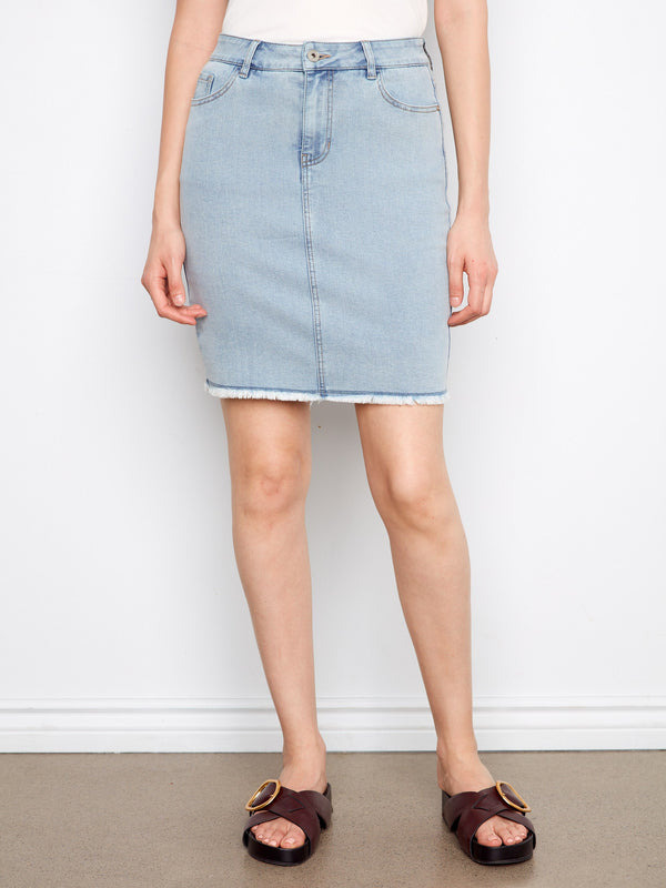 Stylish denim skirt with frayed edge detail, adding a casual touch to your look. By Charlie B.